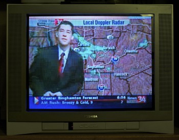 Jordan Gremli '08 predicts the weather on TV in Binghamton, N.Y.