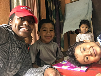 Cornell Tradition fellow Kierra Grayson '19 with children in Nicaragua as part of the Cornell Commitment's annual winter service trip in January. Photo: provided.