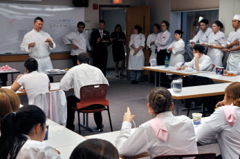 Guest chef Larry Finn gives pre-banquet pep talk to students