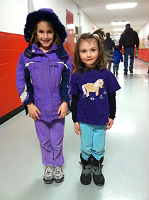 Young fans wear purple at Lynah Rink