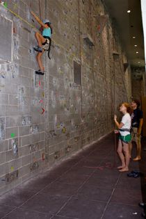 Campers on rock-climbing wall
