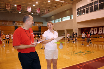 Volleyball coaches chat during summer sports camp
