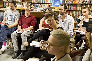 Brooklyn Institute associate faculty member Danya Glabau listens to student comments