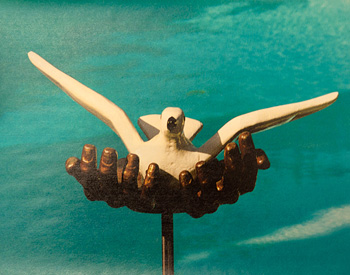 Ned Trethaway photo of bird and hands sculpture