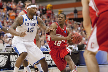 Cornell's Louis Dale drives on Kentucky's DeMarcus Cousins in the Sweet 16