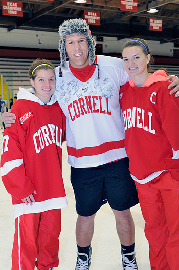 Josh Grider on the ice with Laura Fortino and Catherine White