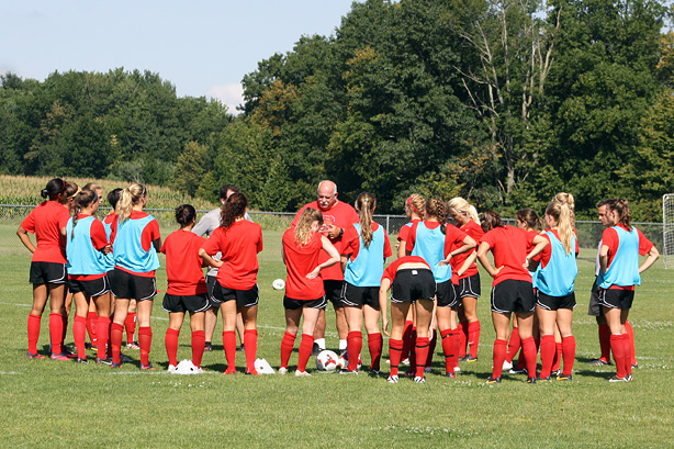 Head coach Patrick Farmer addresses the Big Red women's soccer team