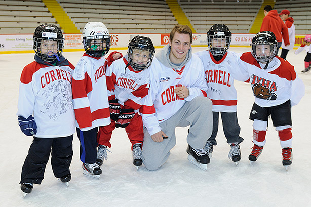 Jake Weidner with boys at Cornell Hockey Association event