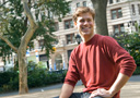 Architecture student Tim Liddell 10 in Madison Square Park with the Flatiron Building in the background.