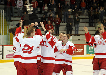 Big Red women's ice hockey team with ECAC Hockey trophy