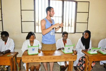 Cornell student Jonah Brill trains teachers at Kagugu Primary School how to use the One Laptop Per Child computers