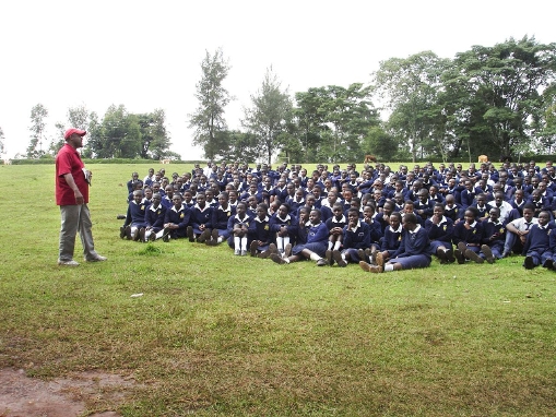 Coach Kevin Thompson speaks to students in Kamobo, Kenya