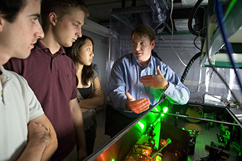 Chris Schaffer with students in the lab