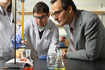 Associate dean Emmanuel Giannelis works with students on a materials science project