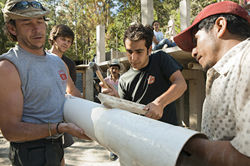 Cornell students with local contractors in Honduras
