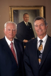 Barron Hilton, left, Steve Hilton and portrait of Conrad N. Hilton