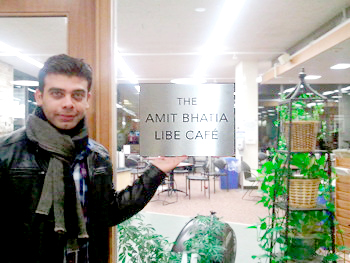 Amit Bhatia '01 shows off the café's new sign