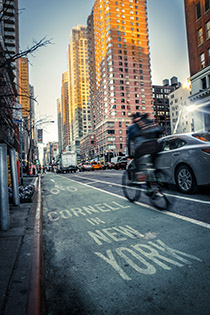 Bicyclist and street scene in Manhattan.