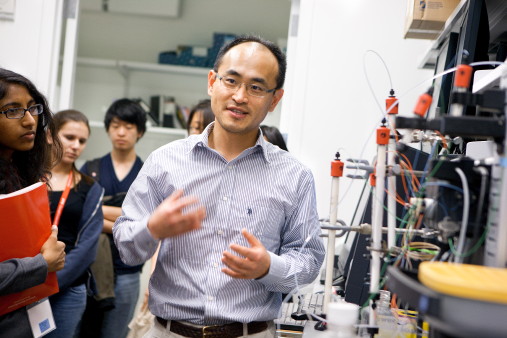 Moonsoo Jin, assistant professor of biomedical engineering, leads a lab tour