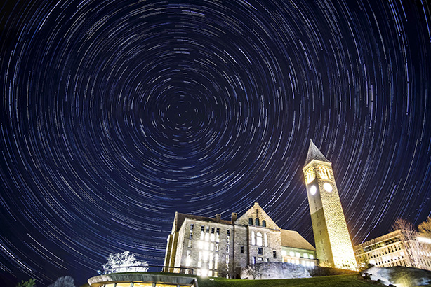 time-lapse night image of McGraw Tower and Uris Library