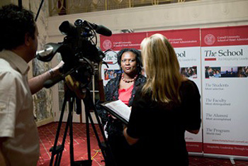 Liz Ngonzi being interviewed at Hotel School awards dinner in New York City