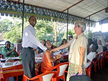 Rebecca Stoltzfus congratulates Honest Massawe in Tanzania
