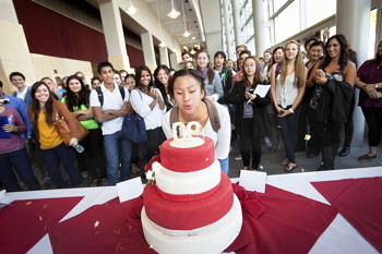 cake and celebrants during Hotel School's 90th birthday party