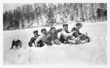 toboggan riders after a ride, early 20th century
