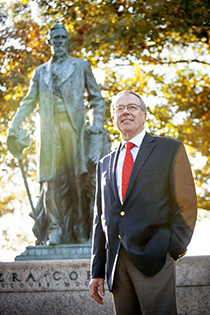Trustee Ezra Cornell with statue of university's founder Ezra Cornell