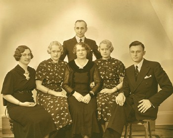 A late 1930's family photo picturing Charles Dyson, at right, with his parents and sisters.