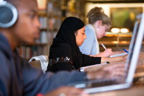 Students in library study spaces