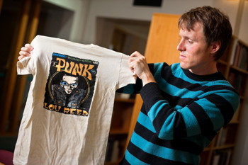 Tom McEnaney, assistant professor of comparative literature, with vintage punk T-shirt 