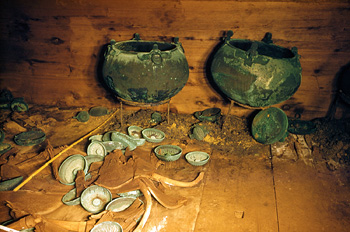 cauldrons and drinking bowls and jugs in burial chamber in central Turkey