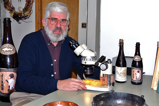 Patrick McGovern with beverage residue sample in laboratory